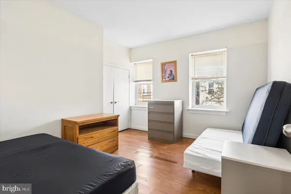 a bedroom with furniture and a window