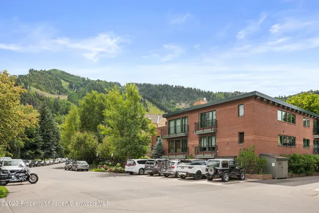 a view of multiple houses with a street