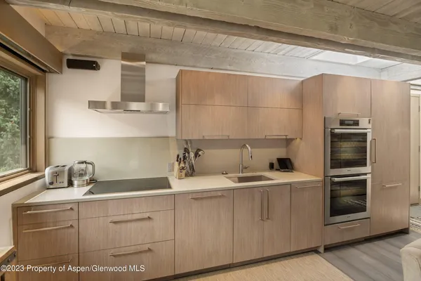 a kitchen with a sink and cabinets