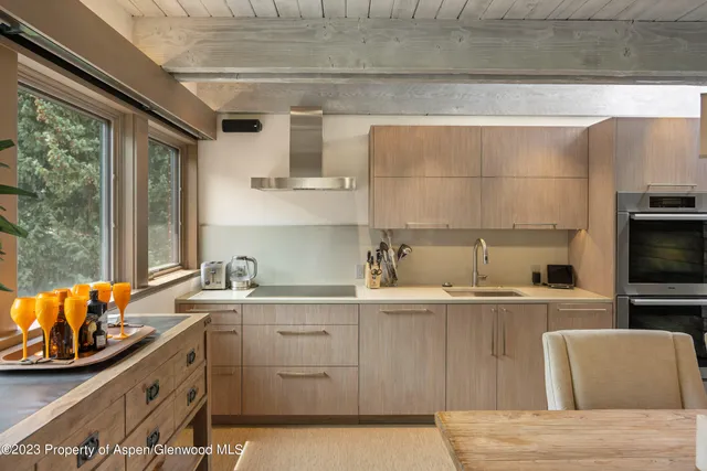 a kitchen with stainless steel appliances granite countertop a sink and cabinets