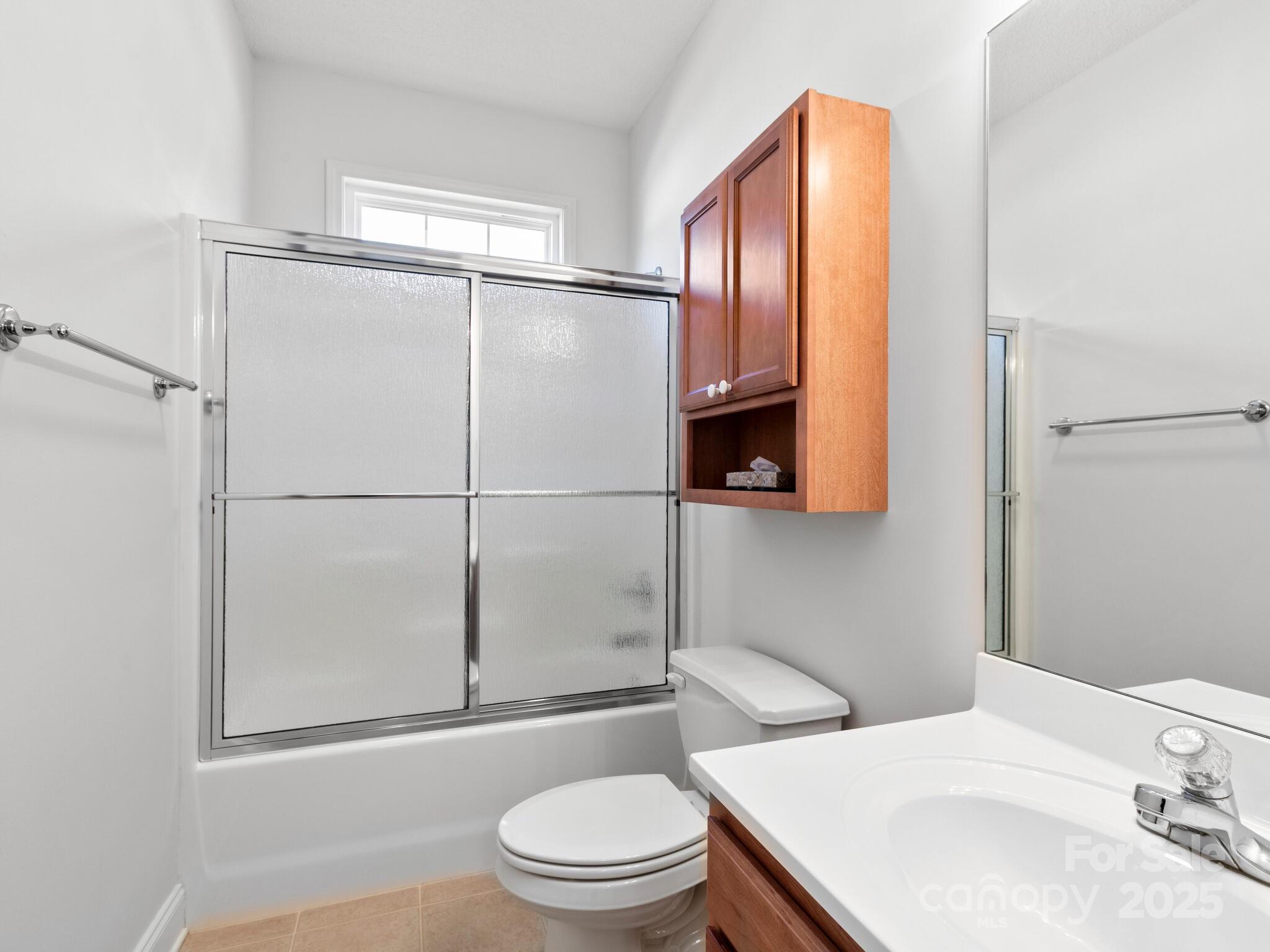 72 Classic Oaks Circle Hendersonville, NC 28792 - Photo 15 of 39 a bathroom with a sink a toilet and shower