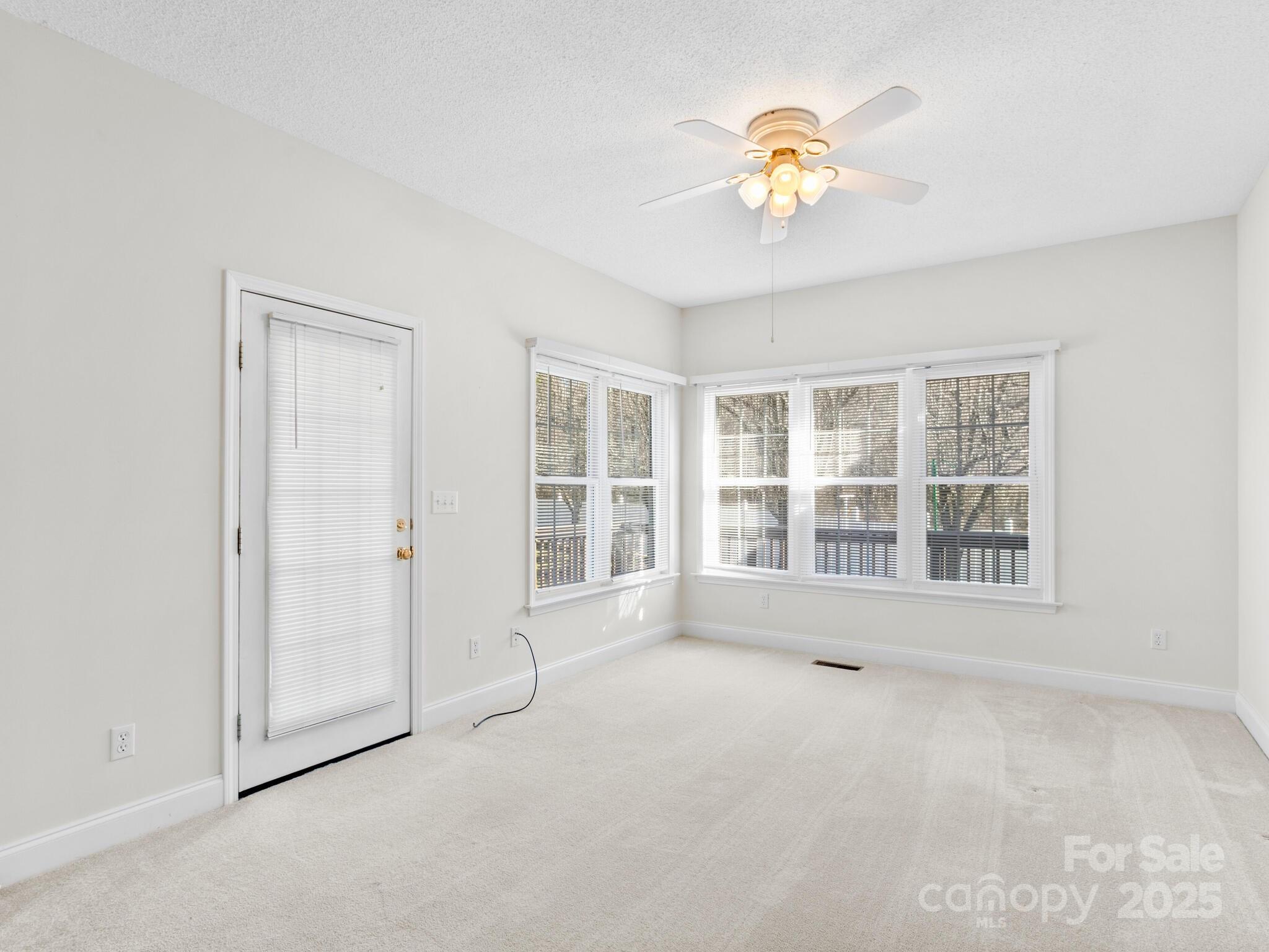 72 Classic Oaks Circle Hendersonville, NC 28792 - Photo 18 of 39 a view of an empty room with a window