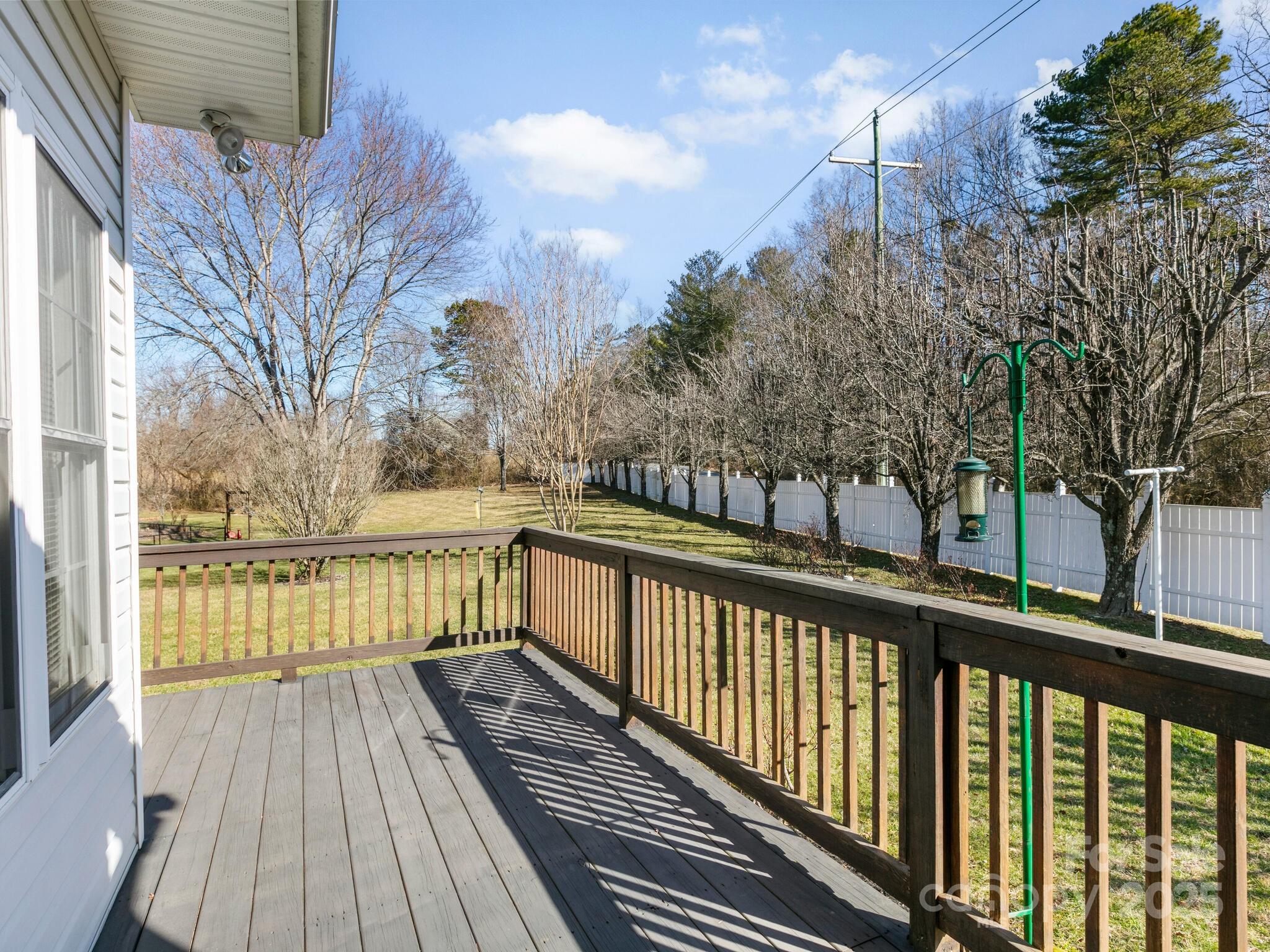 72 Classic Oaks Circle Hendersonville, NC 28792 - Photo 27 of 39 a view of a balcony with wooden floor and fence