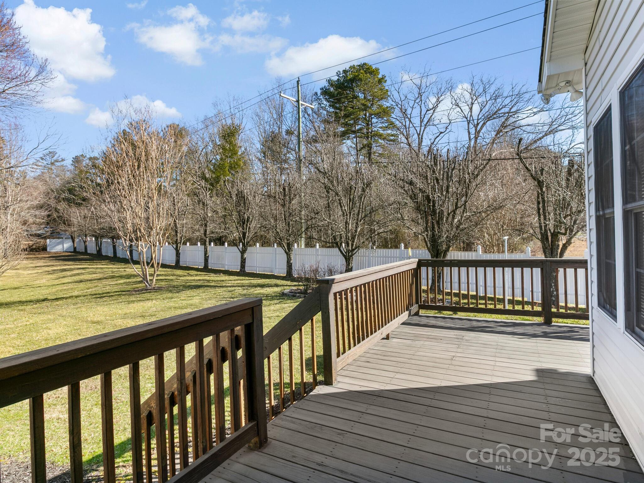 72 Classic Oaks Circle Hendersonville, NC 28792 - Photo 28 of 39 a view of a balcony with wooden floor and fence