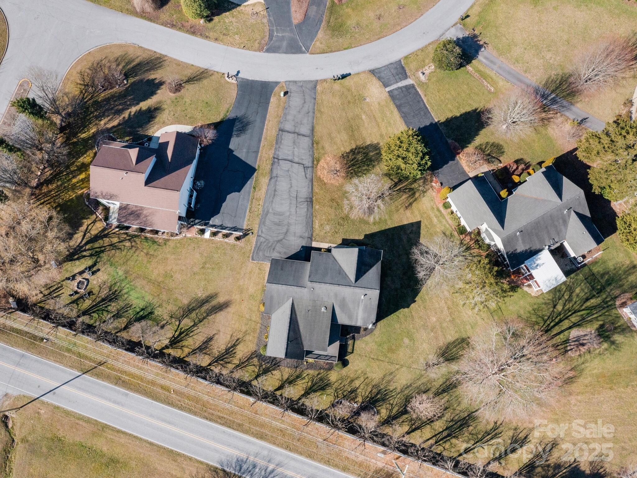 72 Classic Oaks Circle Hendersonville, NC 28792 - Photo 37 of 39 an aerial view of a house with a yard
