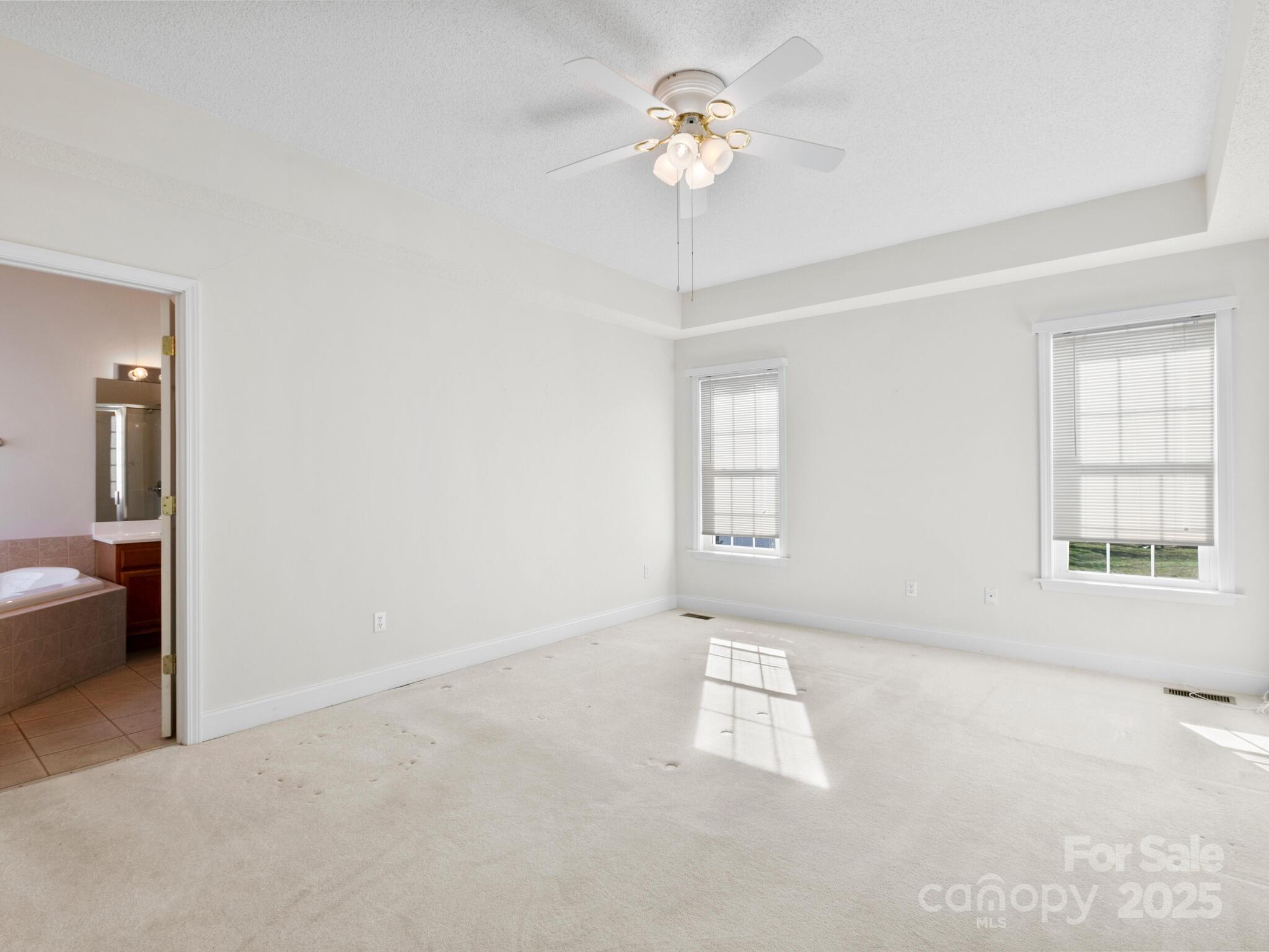 72 Classic Oaks Circle Hendersonville, NC 28792 - Photo 10 of 39 wooden floor in an empty room with a window
