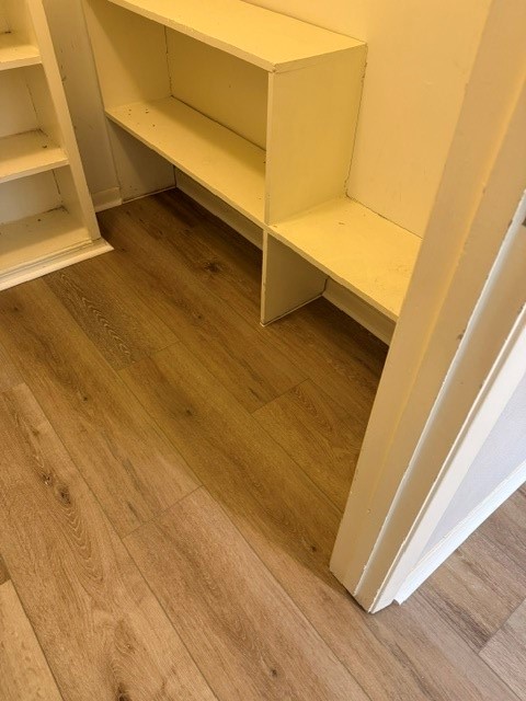5102 Parsley Avenue Baytown, TX 77521 - Photo 12 of 19 a view of a room with wooden floor and white walls