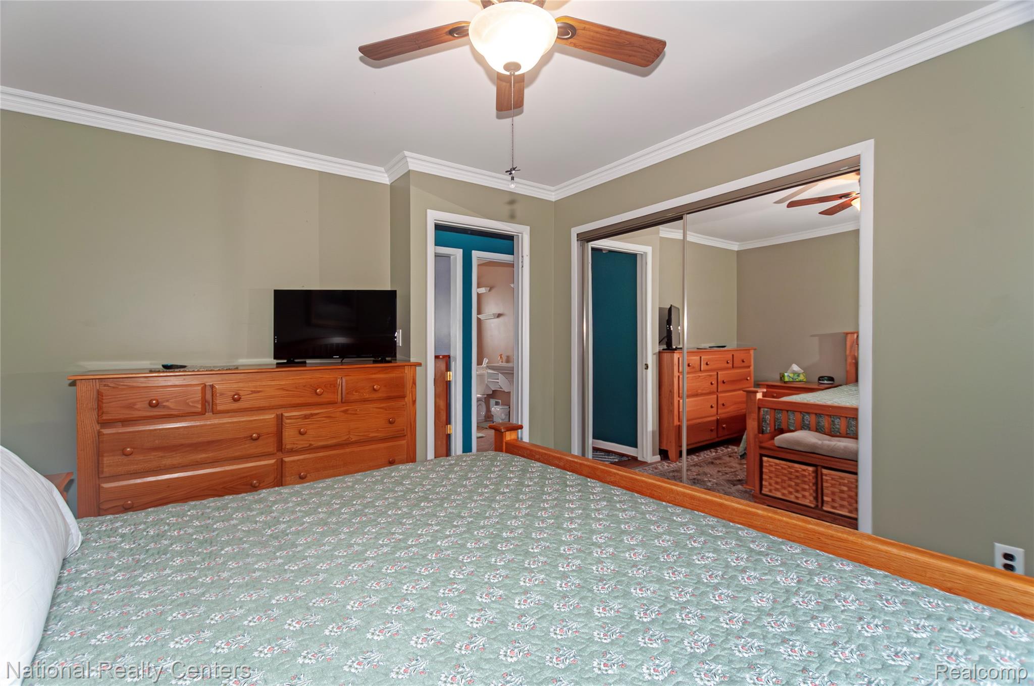 2446 Milverton Road Troy, MI 48083 - Photo 23 of 41 Bedroom featuring ornamental molding, ceiling fan, and a closet