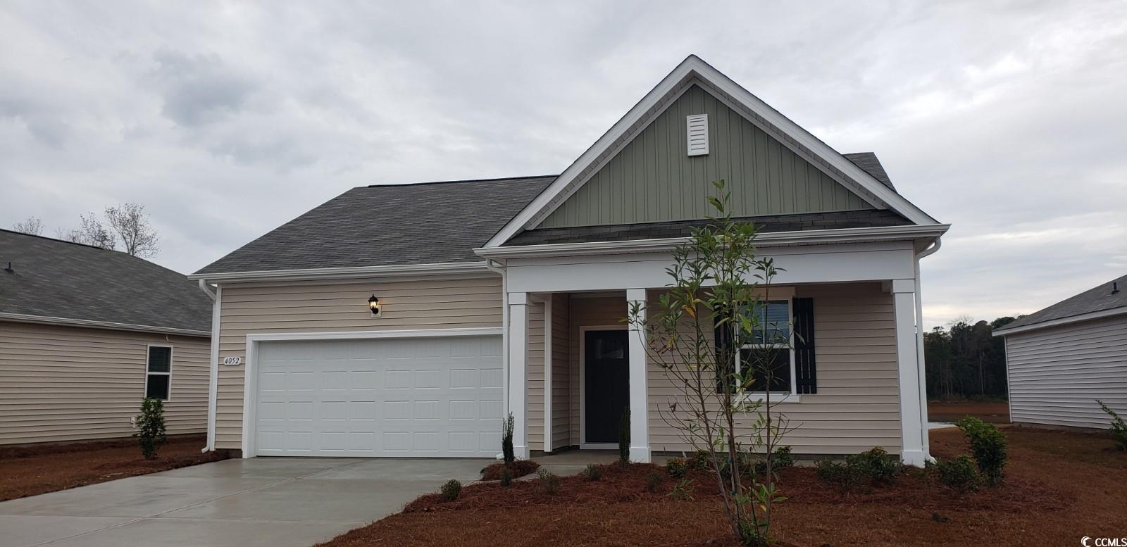 4052 Nelson Road Little River, SC 29566 - Photo 1 of 27 View of front of home featuring a garage