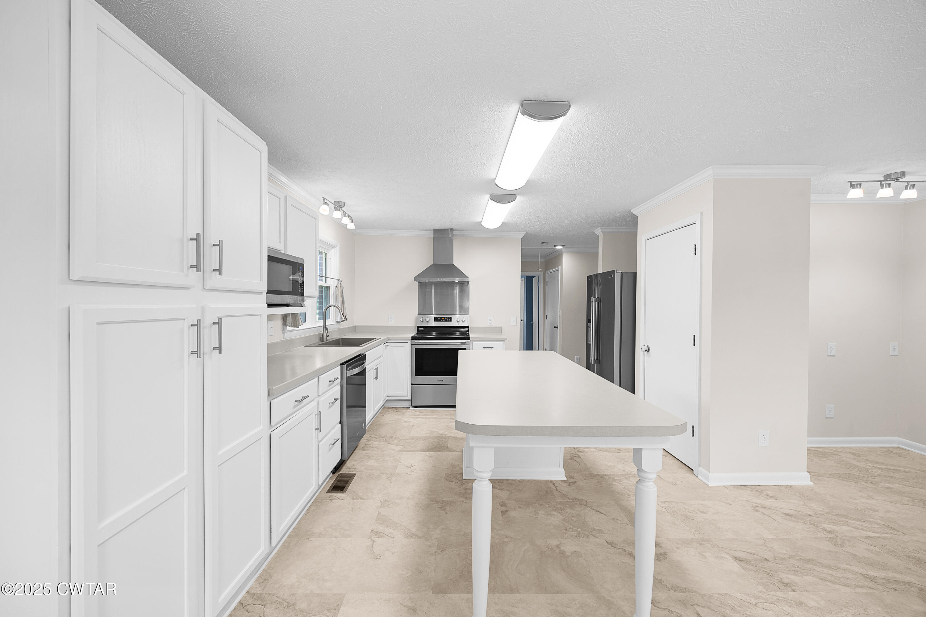 2901 Beech Bluff Road Jackson, TN 38301 - Photo 13 of 23 a kitchen with white cabinets and white appliances