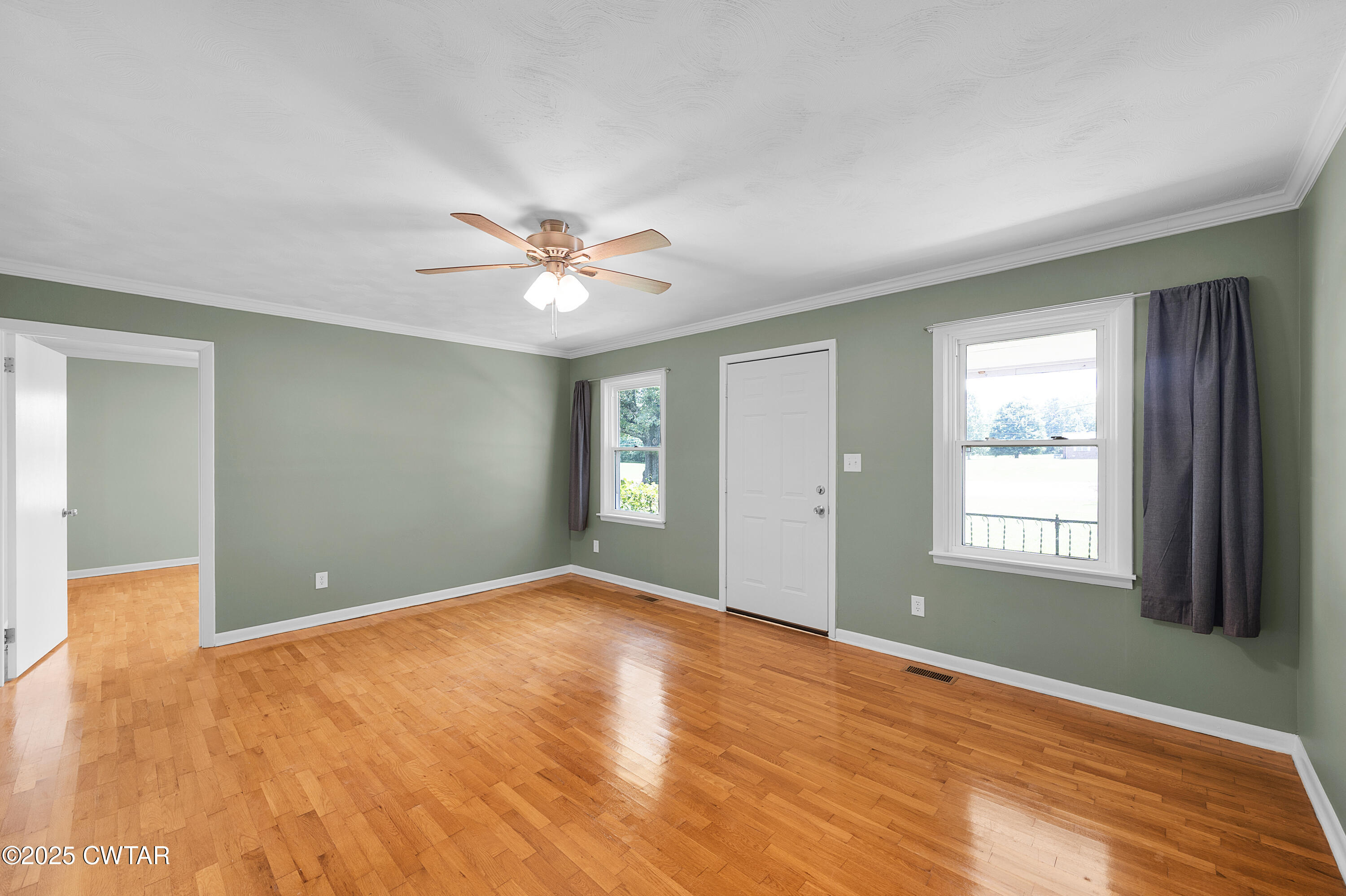2901 Beech Bluff Road Jackson, TN 38301 - Photo 18 of 23 a view of an empty room with window and chandelier fan