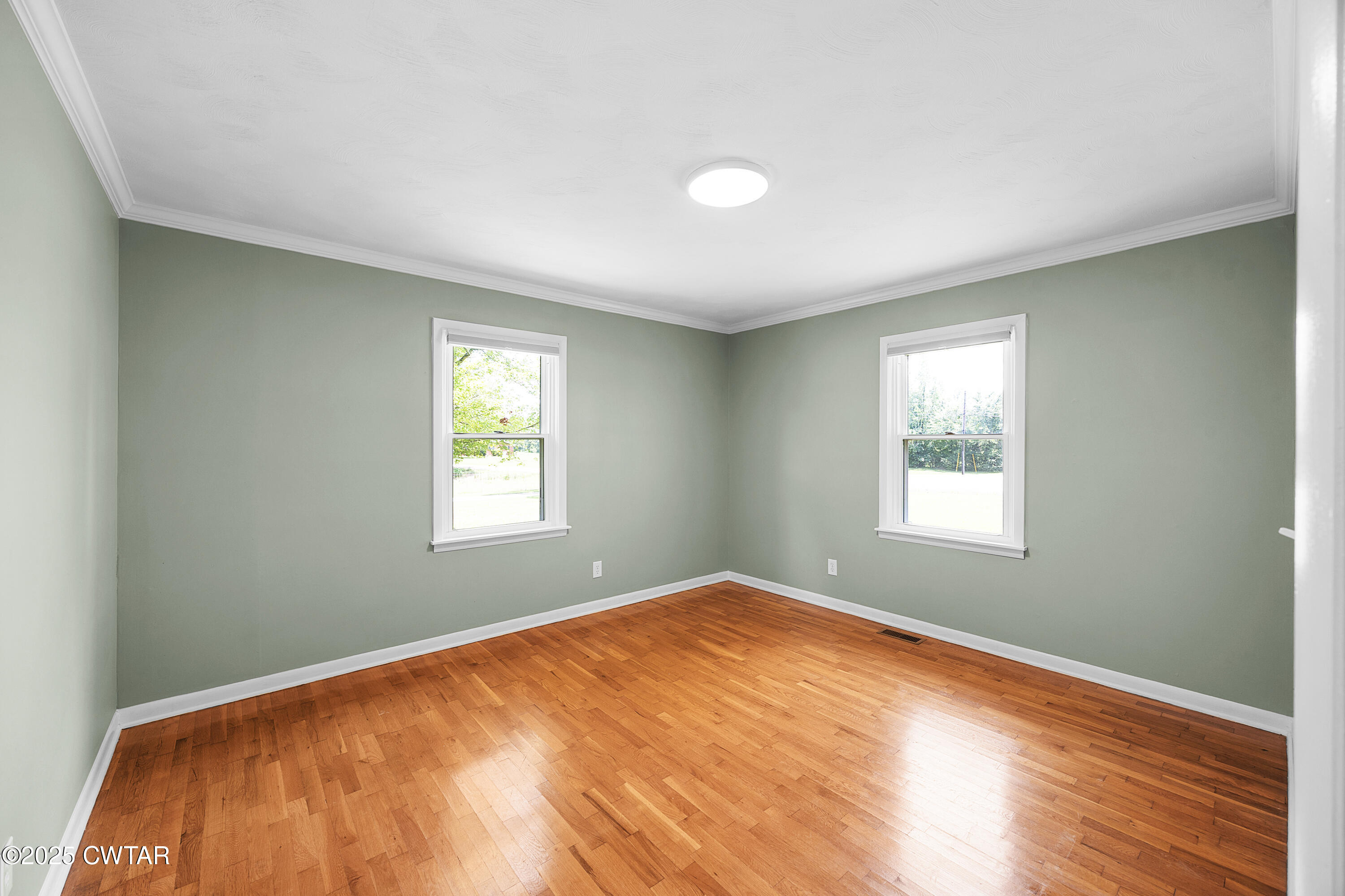 2901 Beech Bluff Road Jackson, TN 38301 - Photo 20 of 23 a view of an empty room with wooden floor and a window