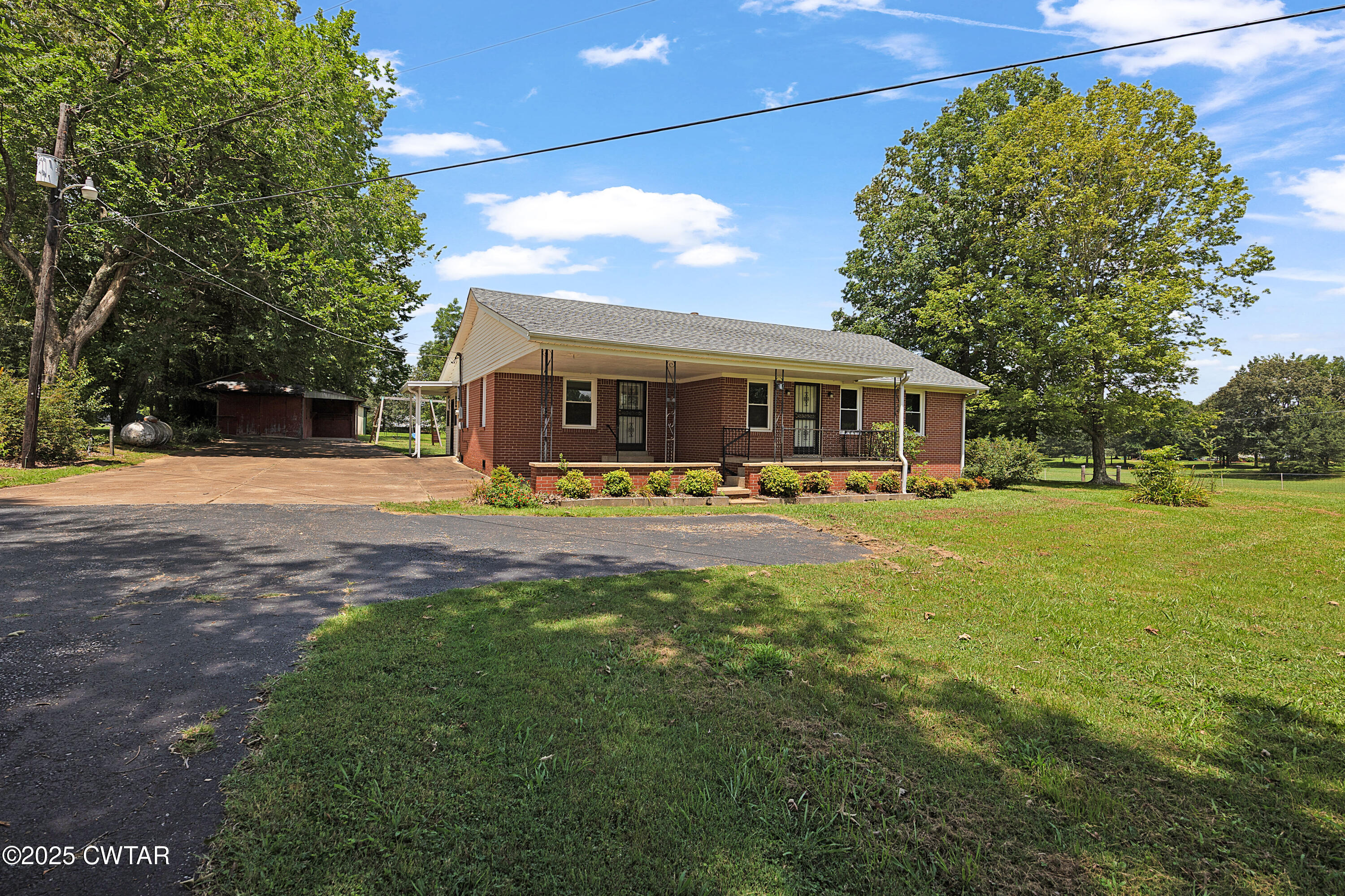 2901 Beech Bluff Road Jackson, TN 38301 - Photo 2 of 23 a view of a house with a big yard