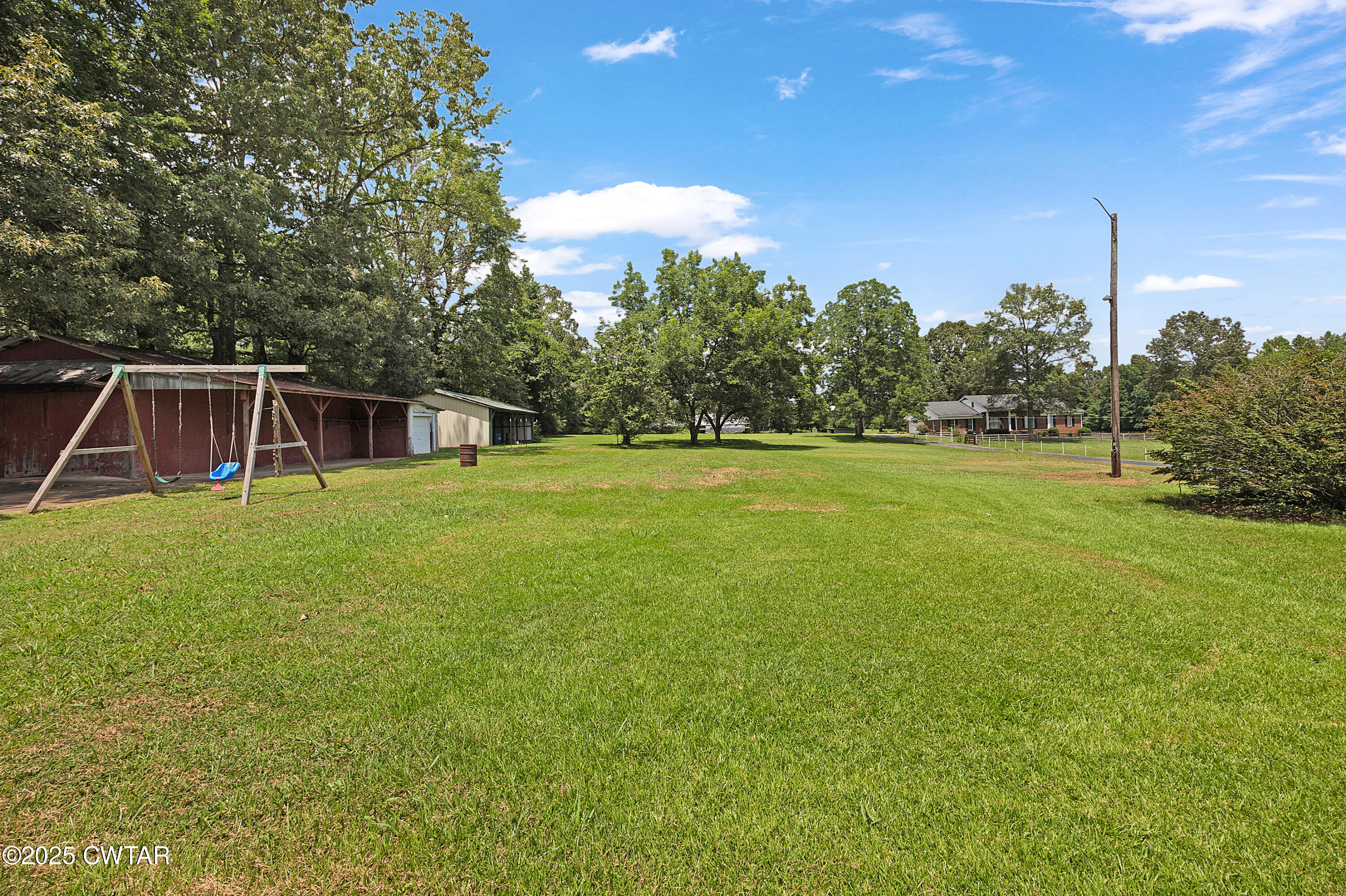 2901 Beech Bluff Road Jackson, TN 38301 - Photo 6 of 23 a view of a house with a backyard