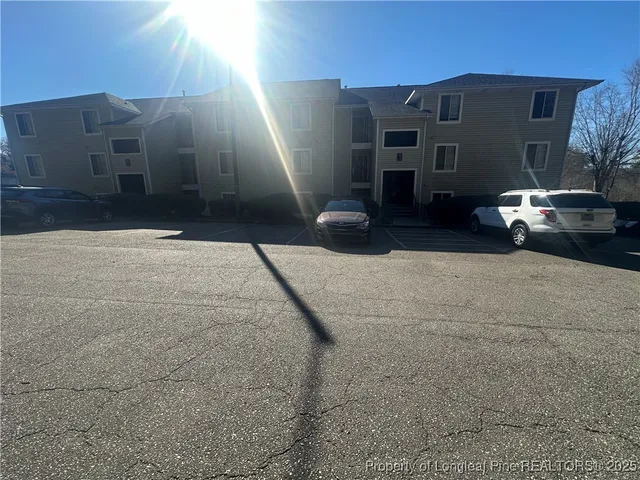 a view of a car park in front of house