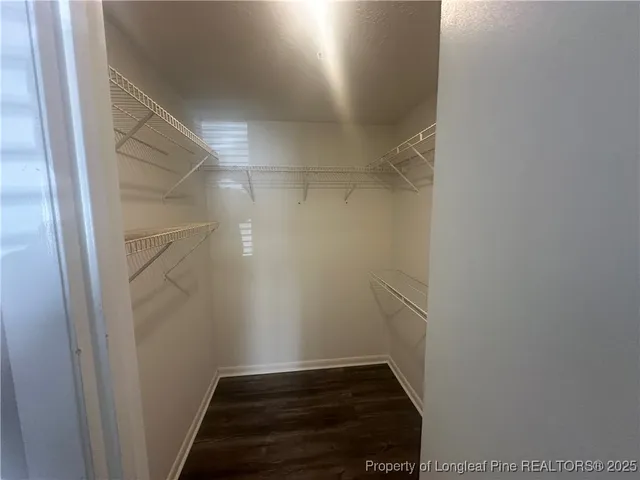 a view of an empty walk in closet
