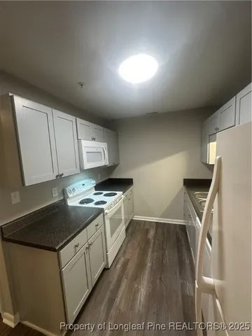 a kitchen that has a sink and a stove