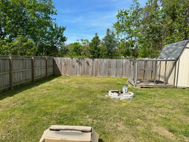 1017 Shadow Ridge Avenue Oak Grove, KY 42262 - Photo 13 of 15 a view of a backyard with wooden fence