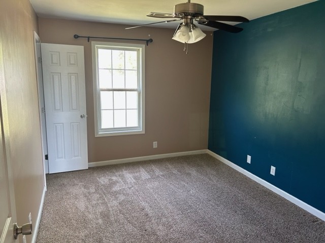 1017 Shadow Ridge Avenue Oak Grove, KY 42262 - Photo 9 of 15 an empty room with windows and chandelier fan