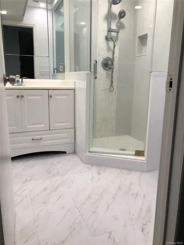 a lobby with furniture and a large window