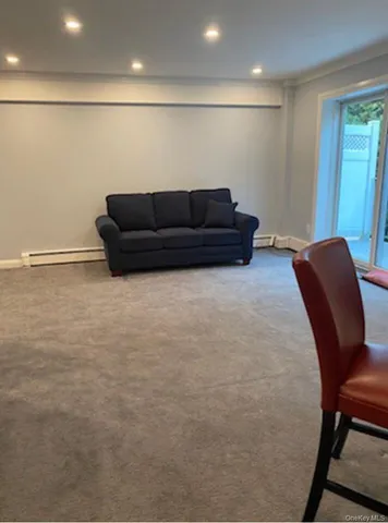 a living room with furniture and a table