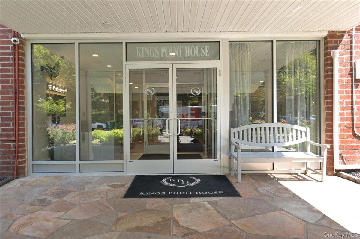 320 East Shore Road, Unit C Great Neck, NY 11023 - Photo 6 of 29 a house view with a outdoor space