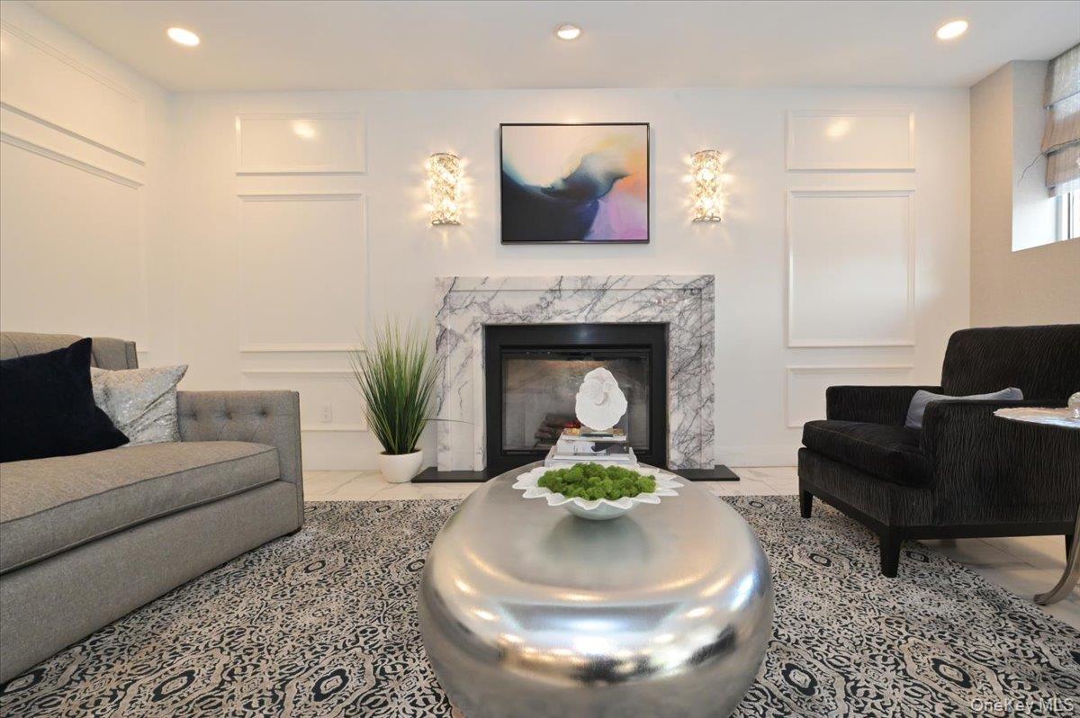 320 East Shore Road, Unit C Great Neck, NY 11023 - Photo 10 of 29 a living room with furniture and a fireplace