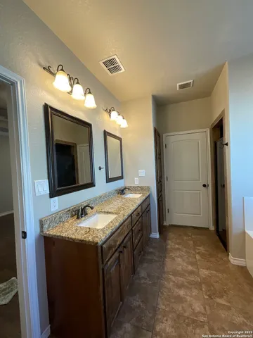 a view of a livingroom with a ceiling fan and window