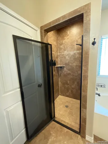 a view of an empty room with a closet