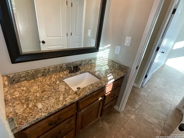 a view of a barn in the middle of a yard