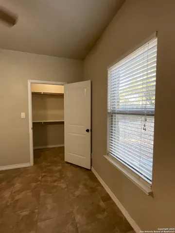 a view of a backyard with a small cabin and a chair