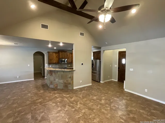 a kitchen with granite countertop a stove and a sink
