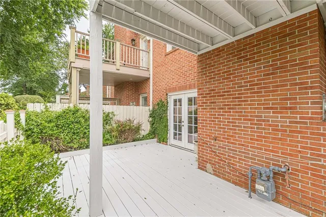 a view of a brick house with a large window
