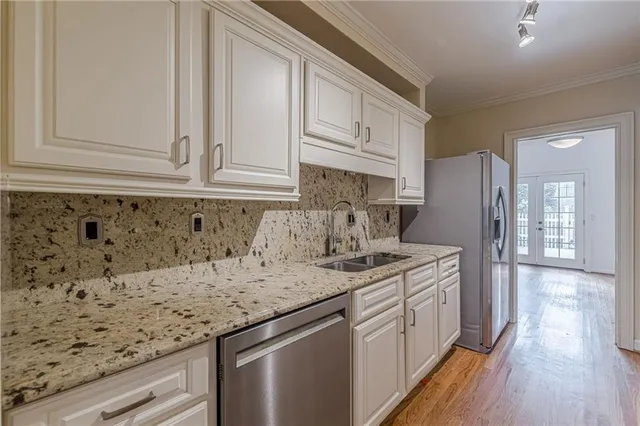 a kitchen with a sink and cabinets