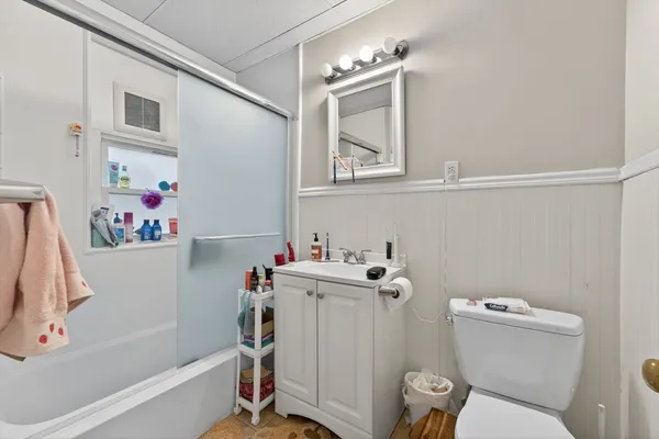 a bathroom with a sink toilet and bath tub