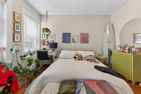 a bedroom with a bed and a table