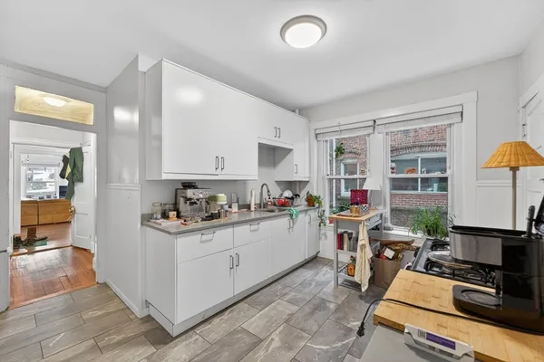 a kitchen with a stove and a refrigerator