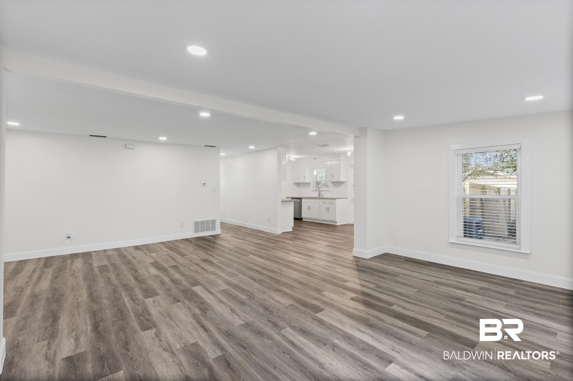 3041 Pretty Branch Drive East Mobile, AL 36618 - Photo 7 of 20 Unfurnished living room with recessed lighting and dark wood-style floors