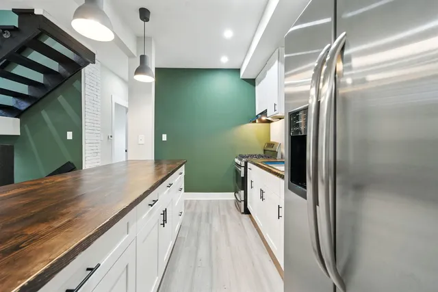 a bathroom with a double vanity sink and mirror