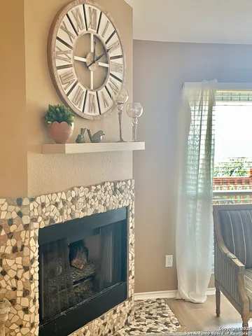 a fireplace with a clock on top of it