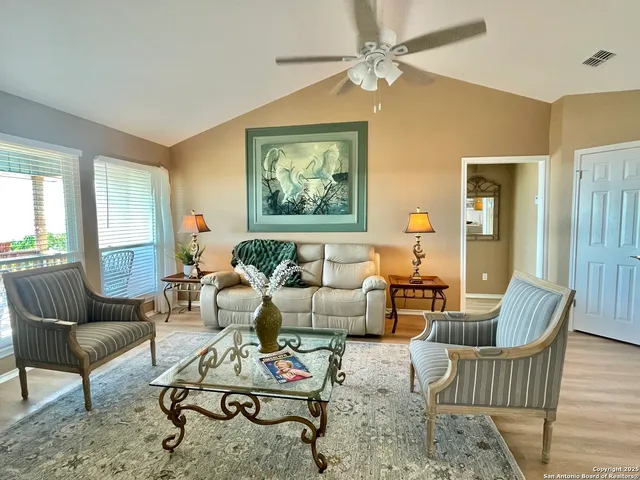 a living room with furniture or couch and a window