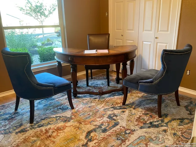 a view of a workspace with furniture