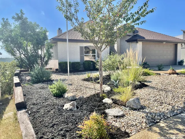 a backyard of a house with yard fire pit and outdoor seating