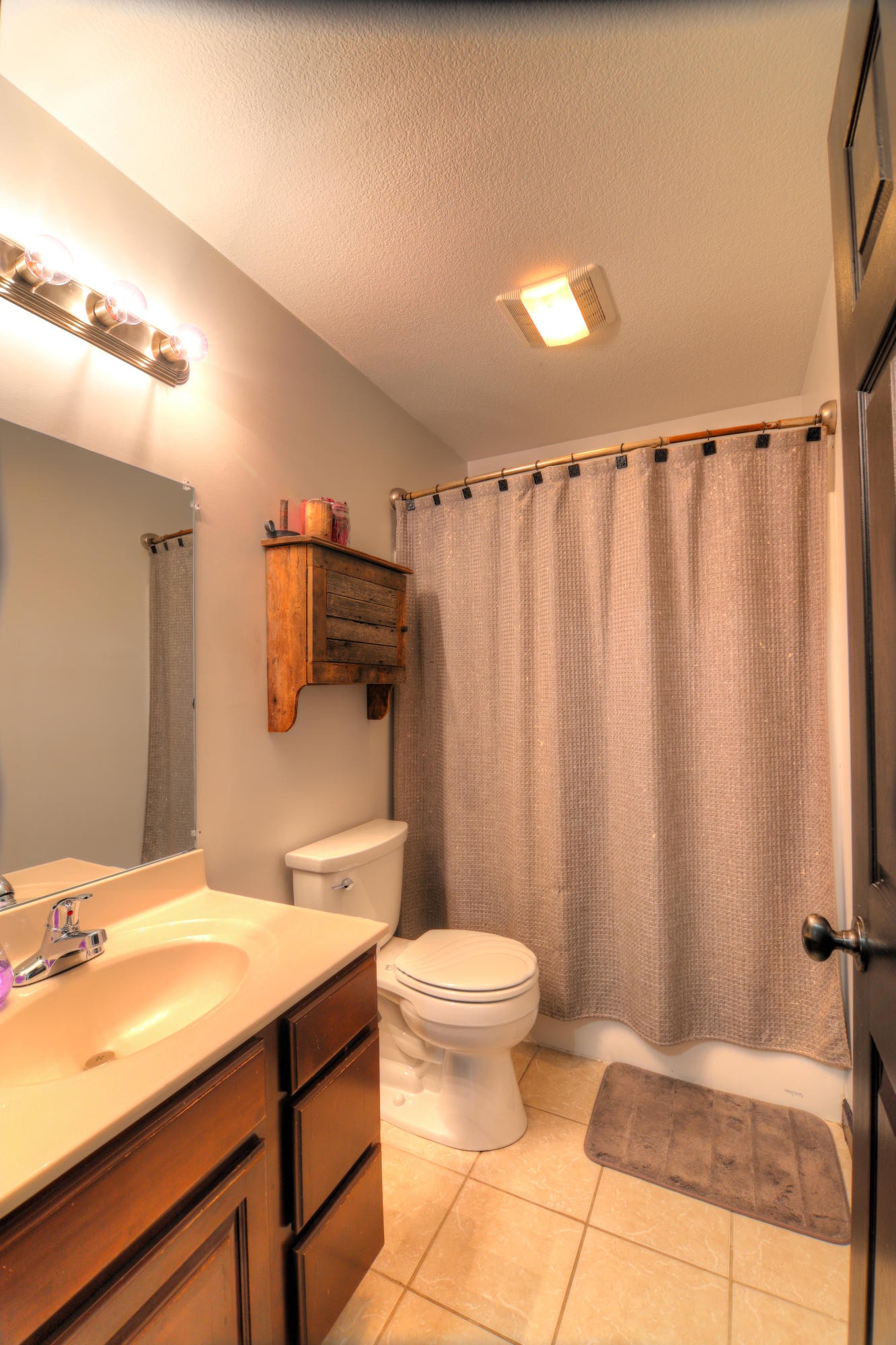 7332 Fort Apache Road Corryton, TN 37721 - Photo 12 of 13 a bathroom with a sink toilet and shower