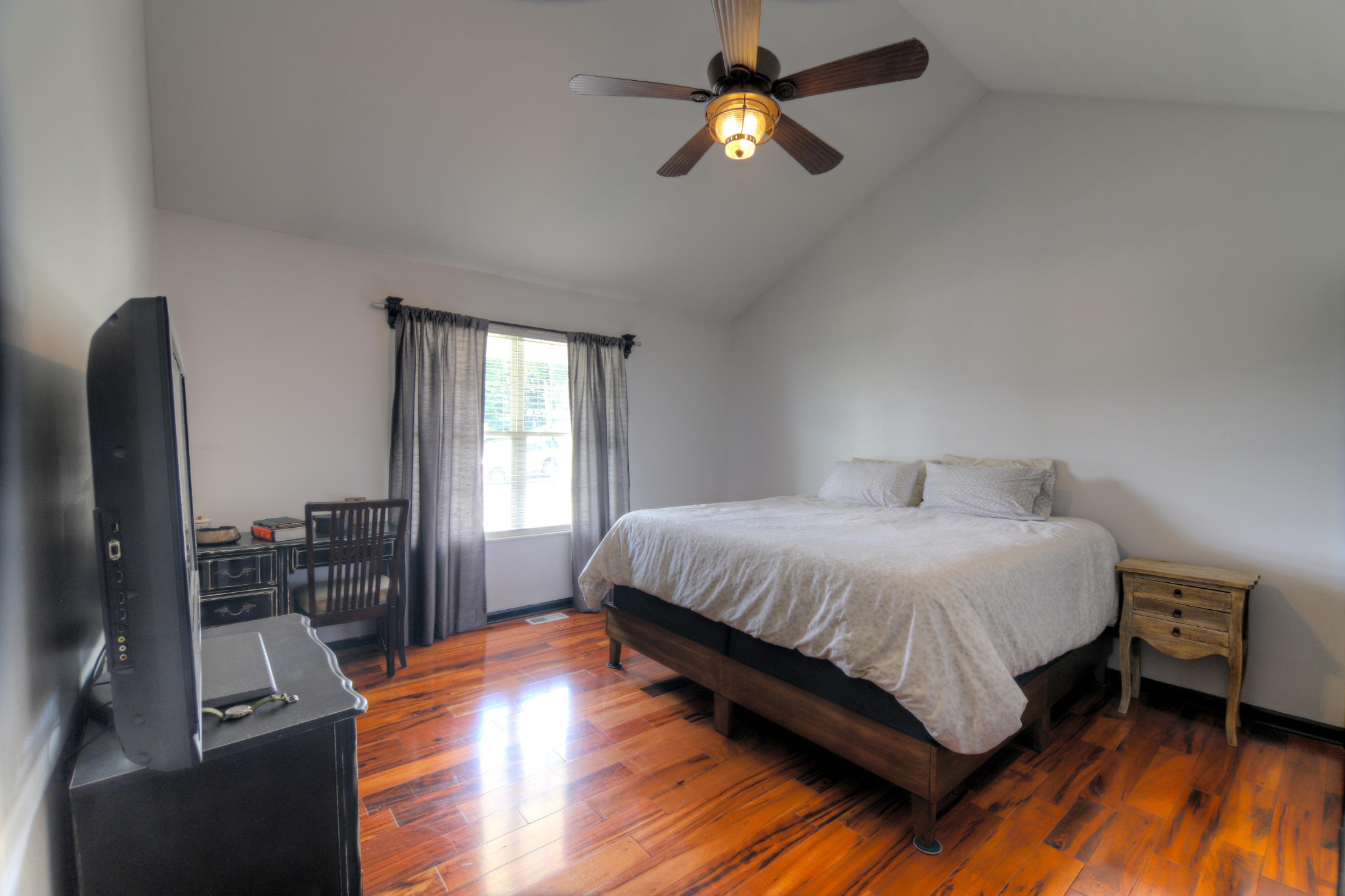 7332 Fort Apache Road Corryton, TN 37721 - Photo 8 of 13 a bedroom with a bed and wooden floor