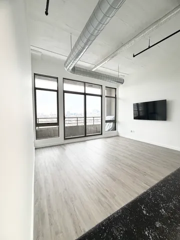 an empty room with wooden floor