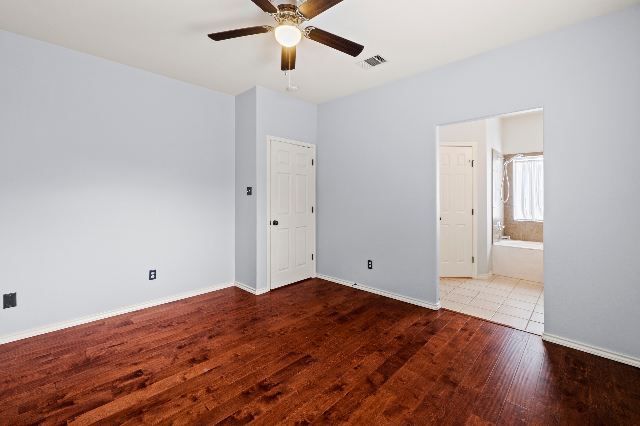 11820 Dunfries Lane Austin, TX 78754 - Photo 14 of 35 a view of empty room with wooden floor