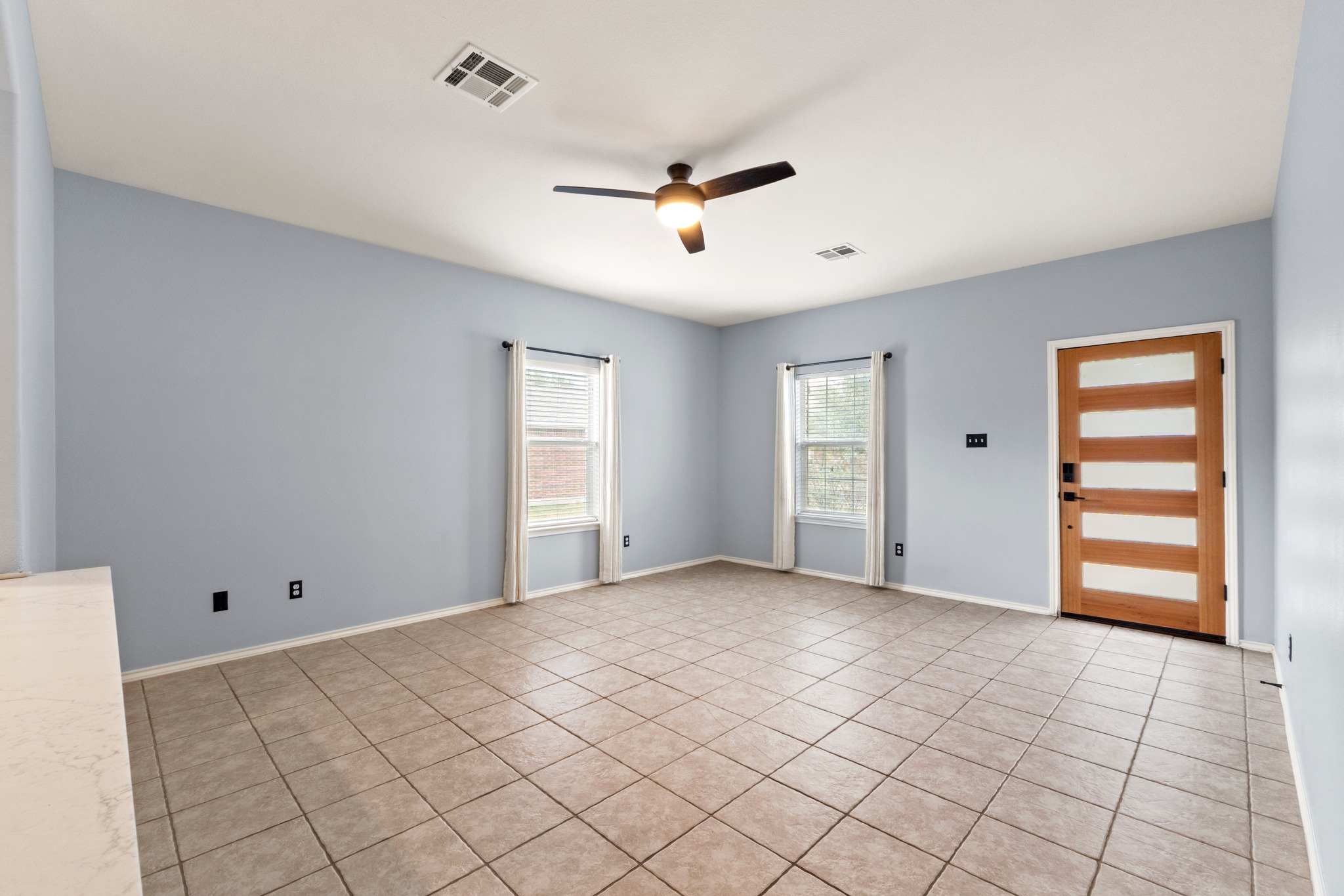 11820 Dunfries Lane Austin, TX 78754 - Photo 5 of 35 a view of an empty room with a window