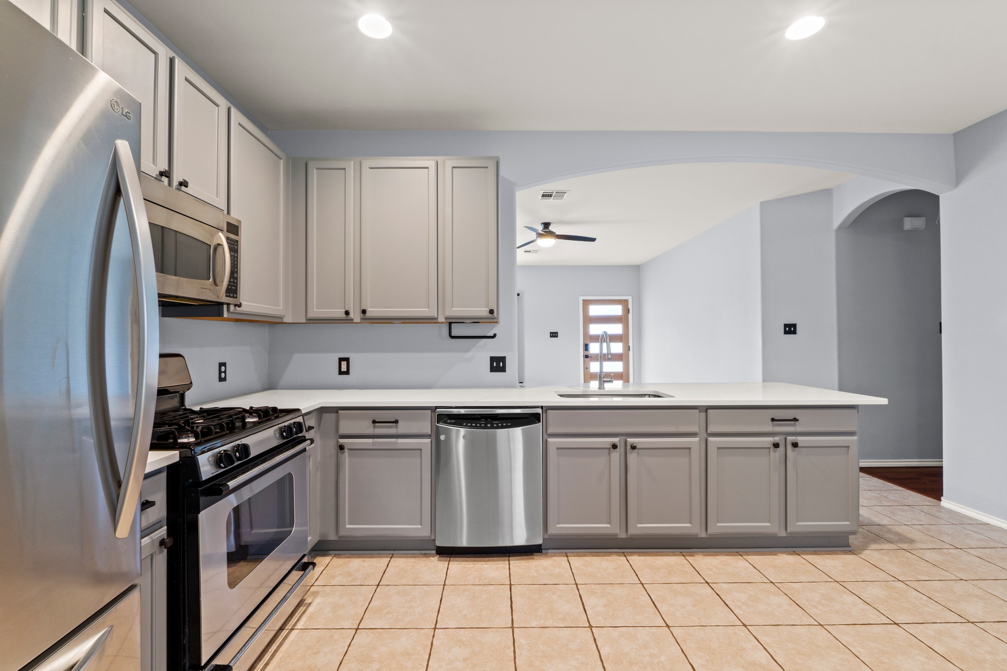 11820 Dunfries Lane Austin, TX 78754 - Photo 10 of 35 a kitchen with stainless steel appliances a sink stove and cabinets