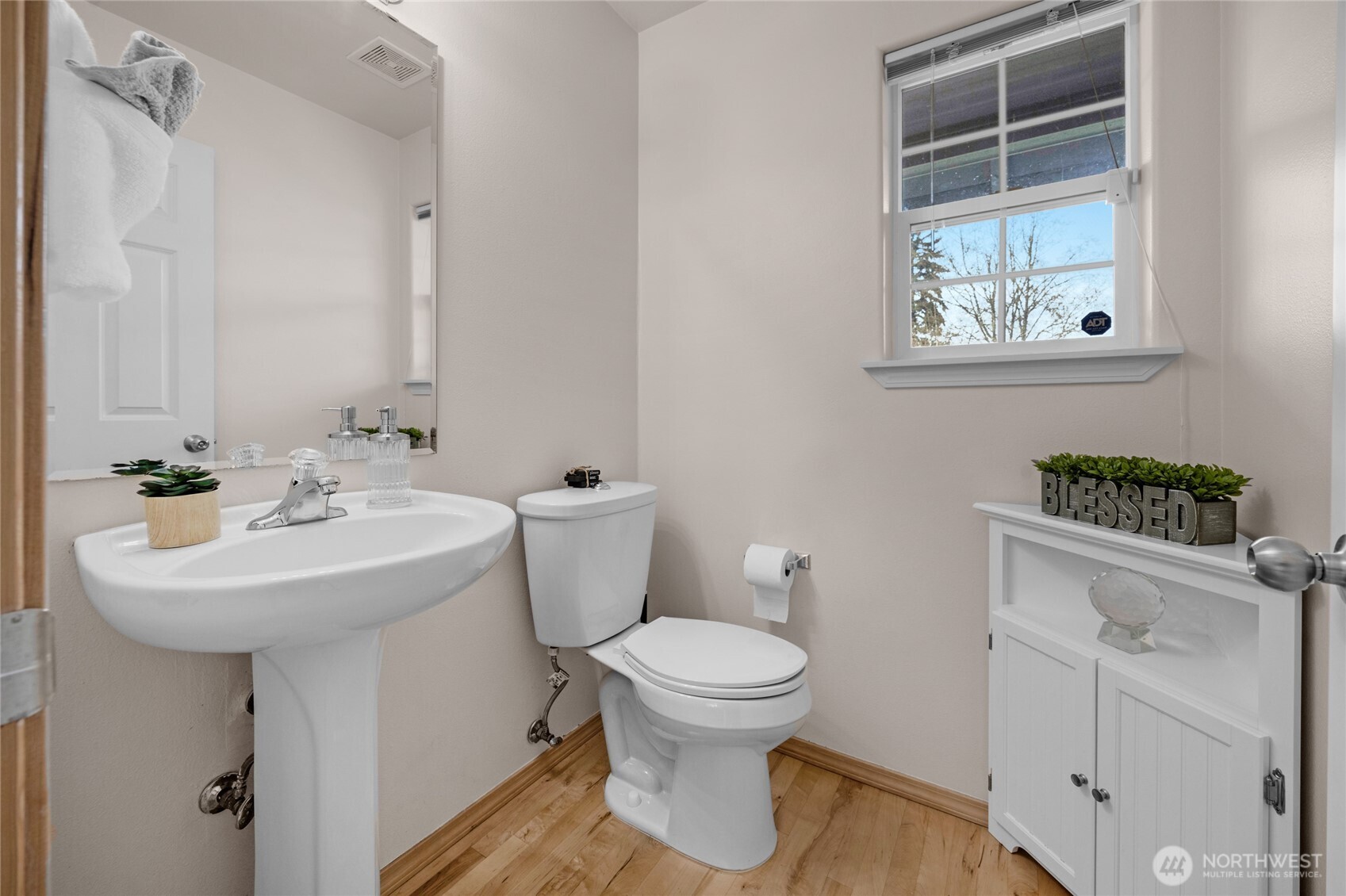 11628 50th Drive Southeast Everett, WA 98208 - Photo 20 of 37 a bathroom with a sink a mirror a toilet and a window